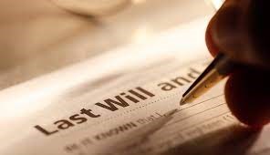 Picture of someone signing a will