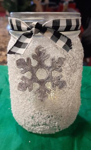 Picture is of a "snow covered" mason jar with decorative ribbon.